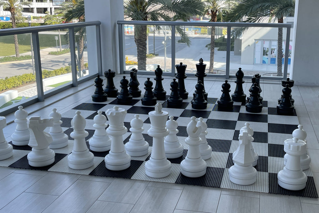 Giant Chess set in a hotel balcony area.