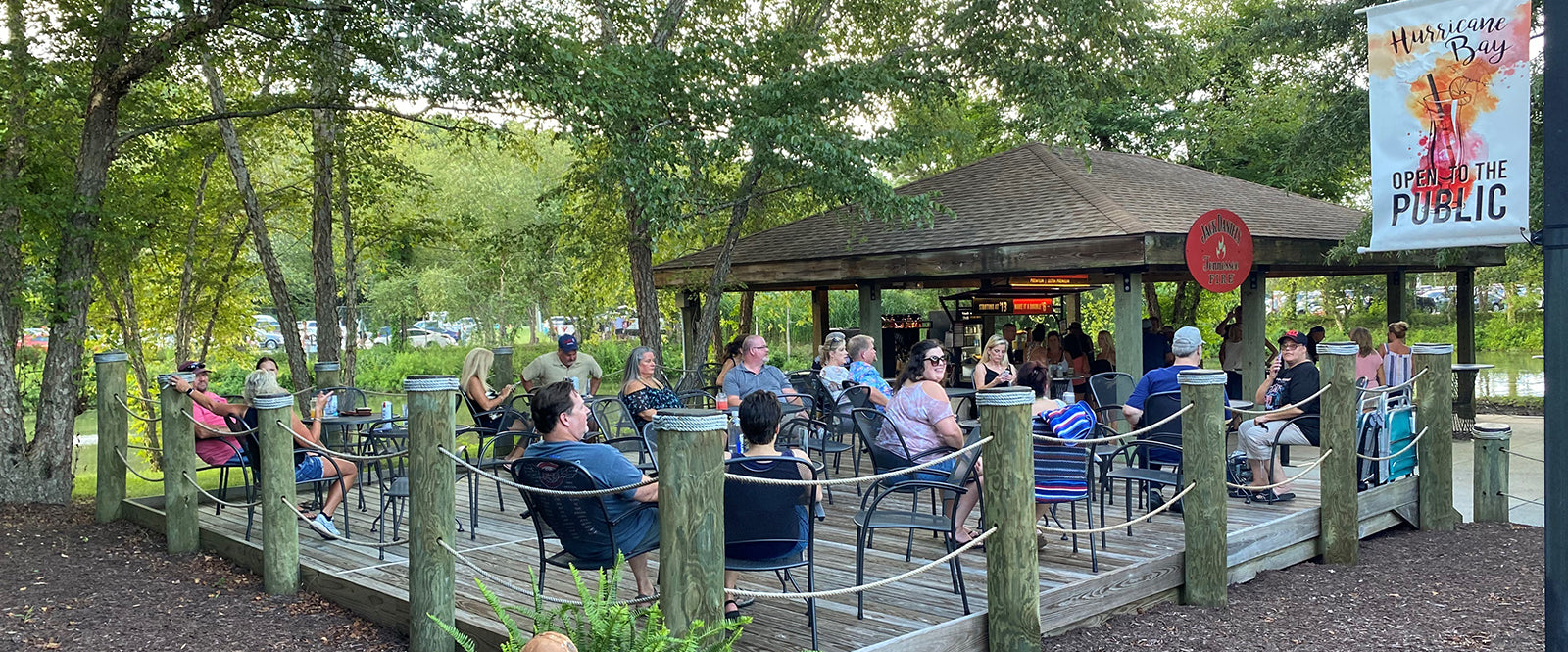 Image of KETTLER patio furniture on a deck at a public concert venue.