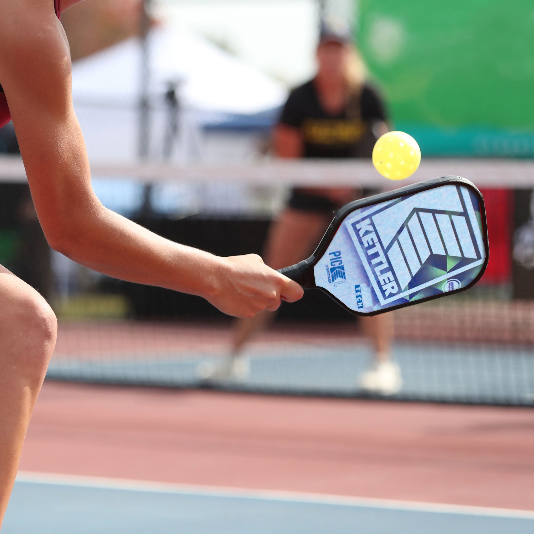 Image of a woman playing pickleball