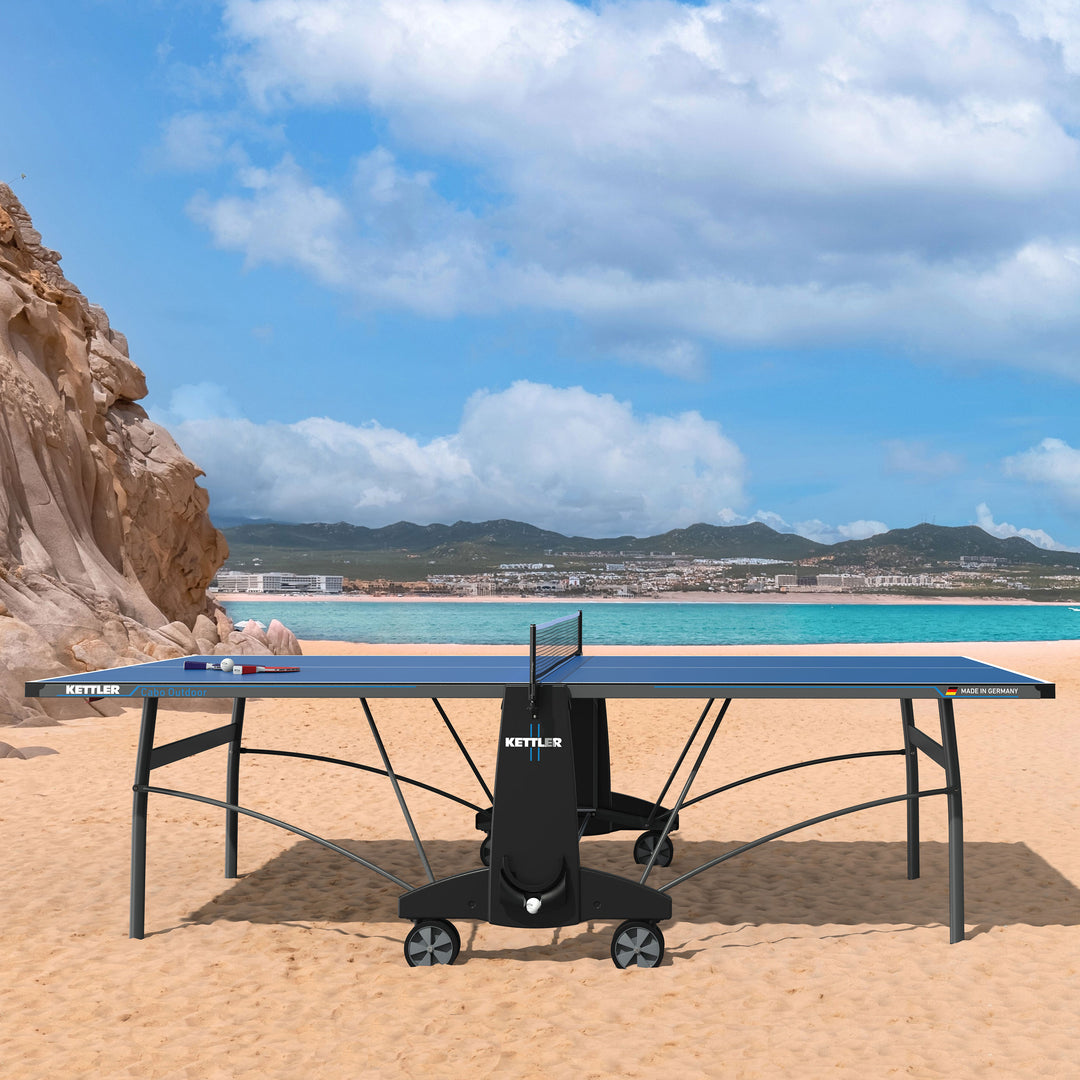 The KETTLER Cabo OUTDOOR table is the perfect table for anyone looking for a fun-filled game of outdoor table tennis with style and great features. The weatherproof KETT-TEC5 table top provides a consistent ball bounce and great durability. This Centerfold table has built-in patented features including SMOOTH TRAX and Dual Locking systems.