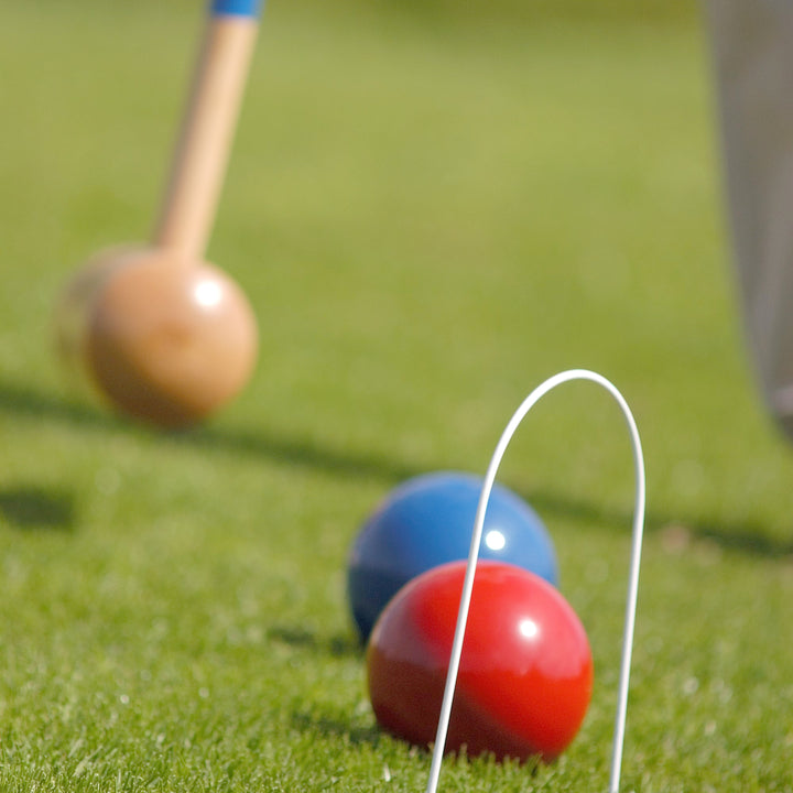 Lifestyle image of people playing the 4 Player Croquet Set