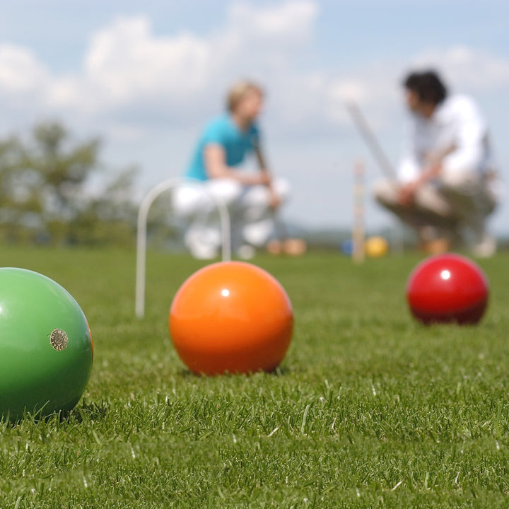 Lifestyle image of people playing the 4 Player Croquet Set