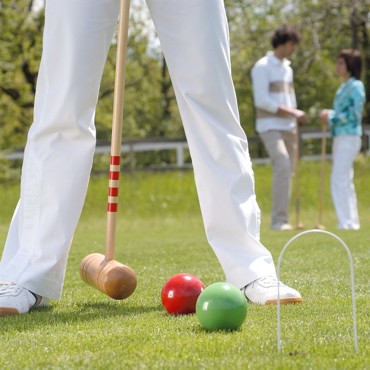 Lifestyle image of people playing the 4 Player Croquet Set