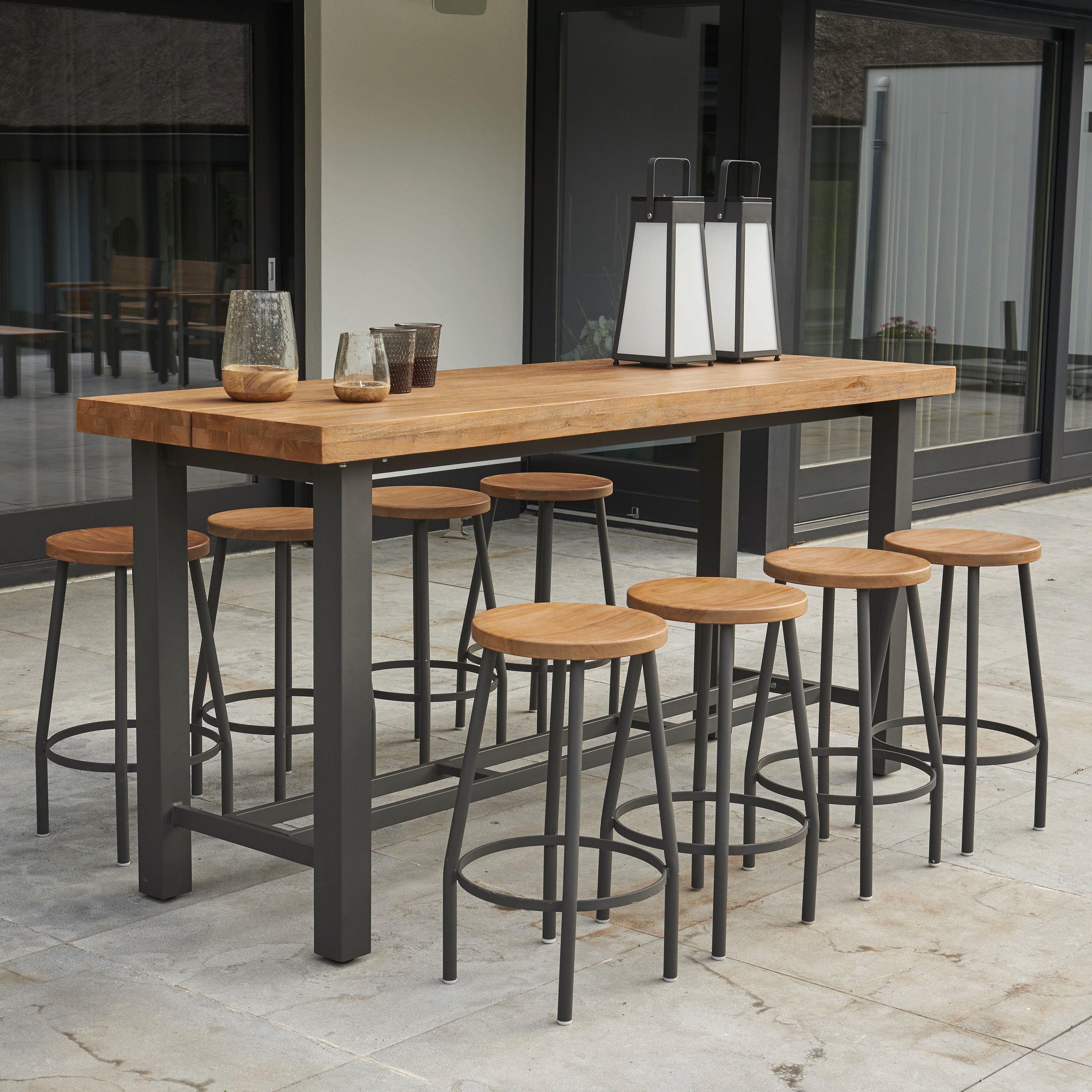Bar height dining with the Nevada Bar Height Table with teak top and Canada Bar Stools with teak tops. From Life Outdoor Living. 