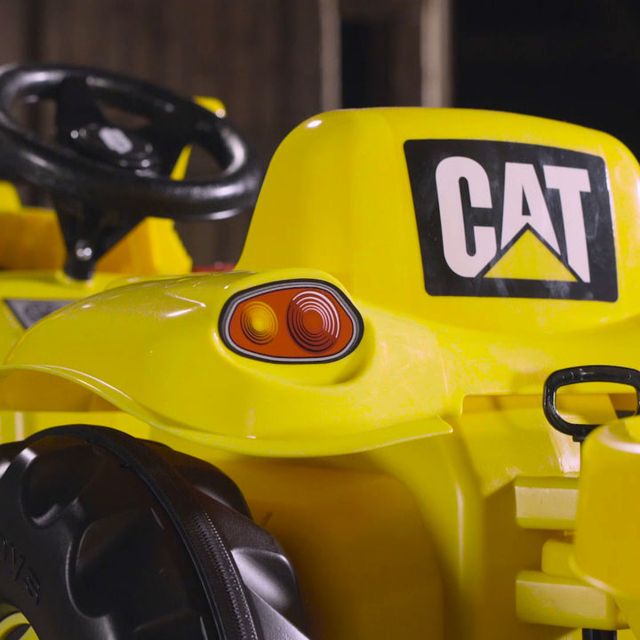Lifestyle image of the back of the seat and CAT logo on the CAT Kid Tractor.