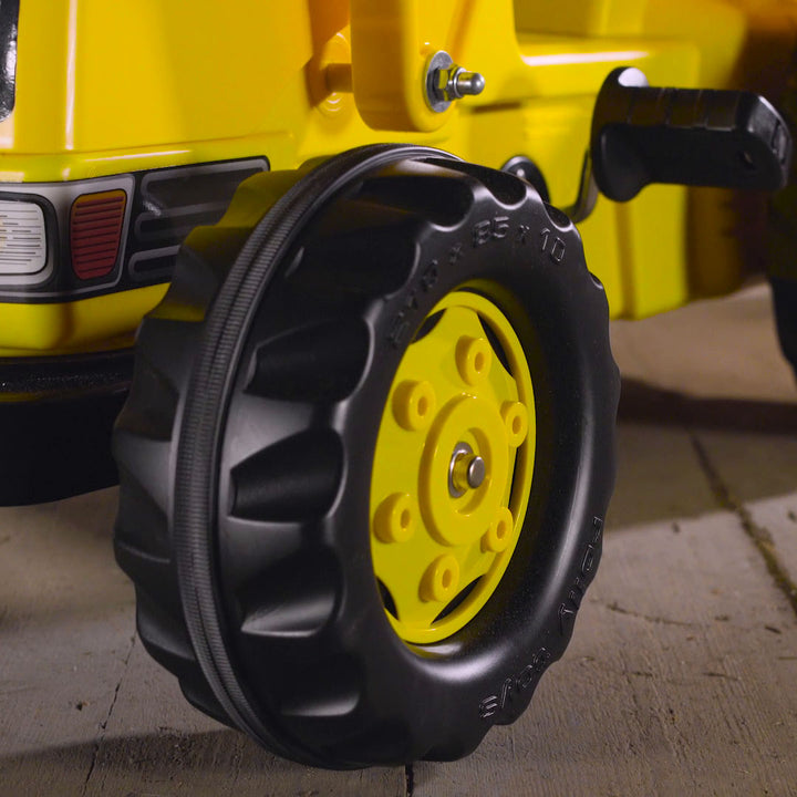 Lifestyle image of the wheel of the CAT Kid Tractor.
