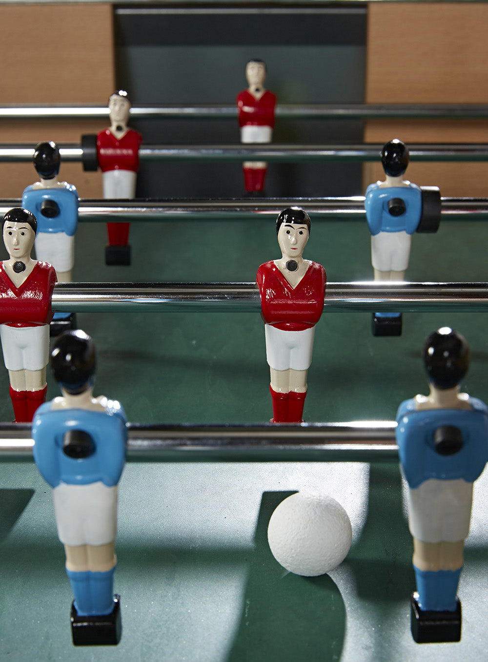 Close up of made in france kicker table players, screwed on