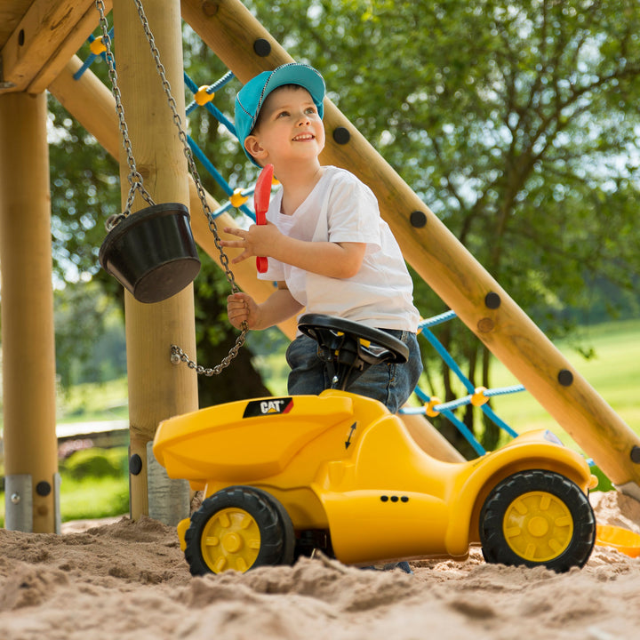 Lifestyle shot of CAT resin toy in sandbox