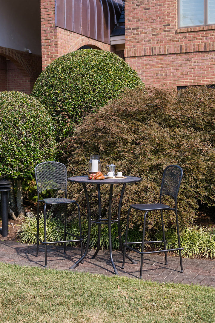 KETTLER wrought iron bar set outside on patio