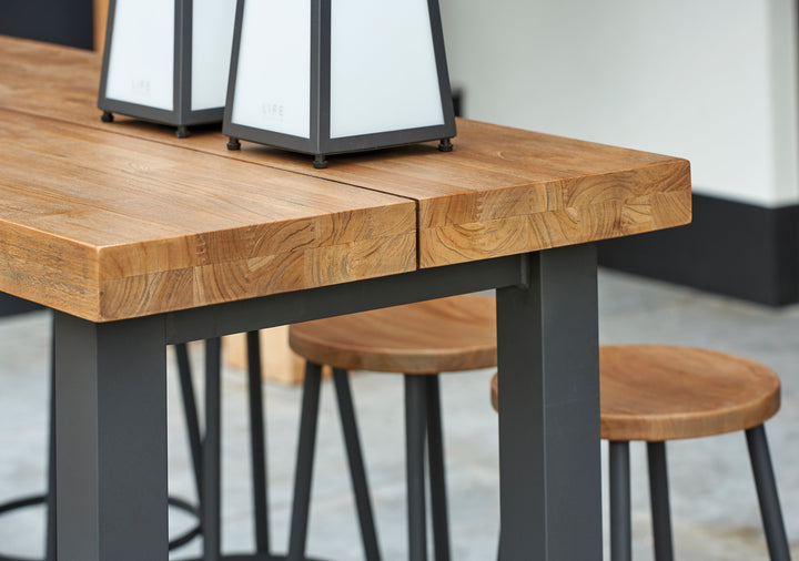 With its powder coated construction and 100% Indonesian SVLK certified teak tops, the Nevada Bar Set is a true work of art.  The combination of durable aluminum frame and warm robust teak gives it an eye-catching industrial look that will surely grab the attention of the most disconcerting critic. 