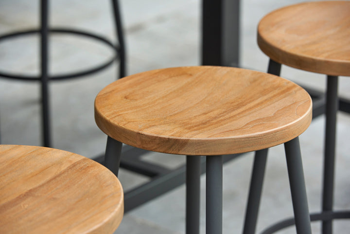 With its powder coated construction and 100% Indonesian SVLK certified teak tops, the Nevada Bar Set is a true work of art.  The combination of durable aluminum frame and warm robust teak gives it an eye-catching industrial look that will surely grab the attention of the most disconcerting critic.