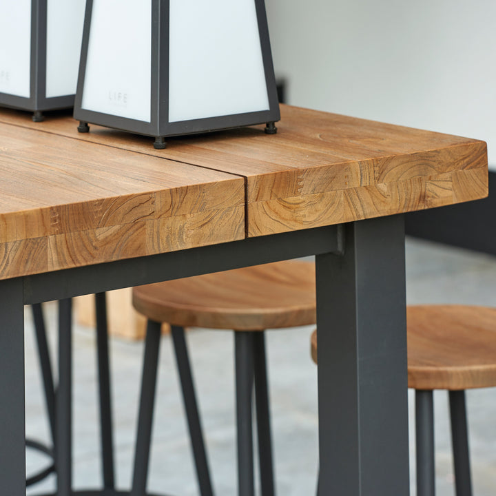 With its powder coated construction and 100% Indonesian SVLK certified teak top, the Nevada Bar Table is a true work of art.  The combination of durable aluminum frame and warm robust teak gives the Nevada bar table an eye-catching industrial look that will surely grab the attention of the most disconcerting critic. 