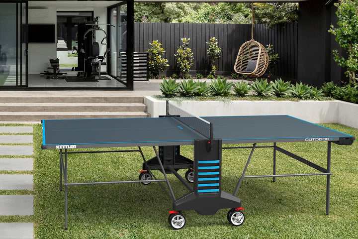 lifestyle shot of outdoor game table in backyard