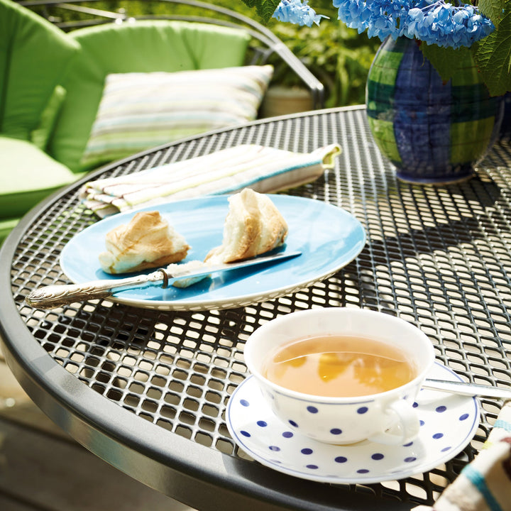 KETTLER® utilizes an exclusive Electrotherm™ coating technology on all of wrought furniture. This finish is three (3) times thicker than a conventional powder coat. The Electrotherm™ coating creates an extremely smooth finish with obsolete weld points and resists scratching, peeling, fading and chipping. Another advantage is that the furniture will remain approximately twenty percent (20%) cooler after long sun exposure.