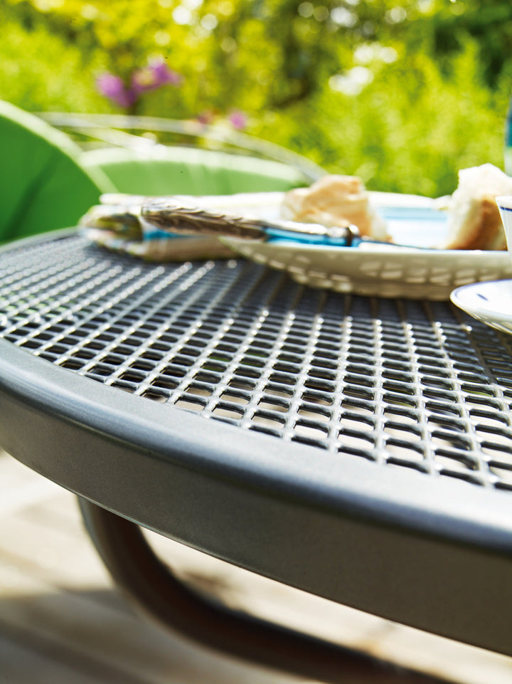 KETTLER® utilizes an exclusive Electrotherm™ coating technology on all of wrought furniture. This finish is three (3) times thicker than a conventional powder coat. The Electrotherm™ coating creates an extremely smooth finish with obsolete weld points and resists scratching, peeling, fading and chipping. Another advantage is that the furniture will remain approximately twenty percent (20%) cooler after long sun exposure