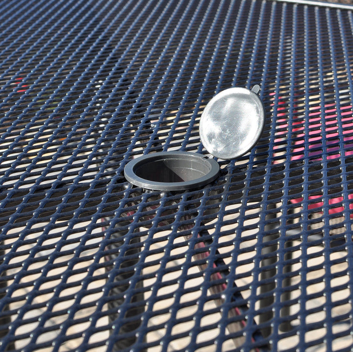 Closeup of the umbrella hole on the KETTLER wrought iron table