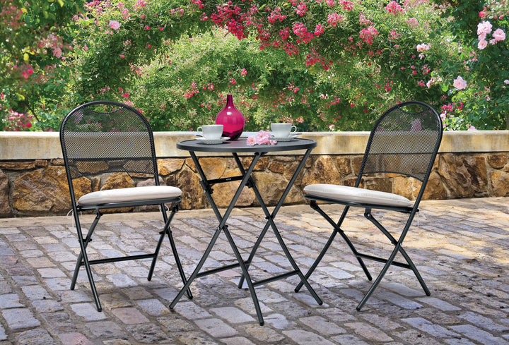 Lifestyle image of fedexable three piece wrought iron set on back porch