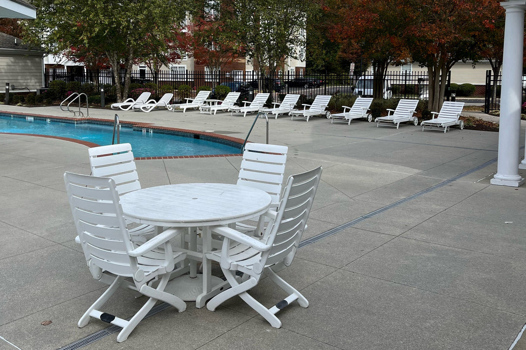 Kettler Patio furniture in a commercial outdoor patio pool area. 