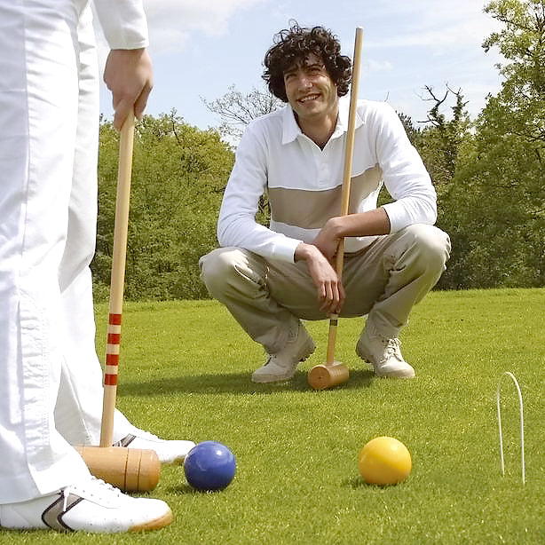 Lifestyle image of people playing the 4 Player Croquet Set