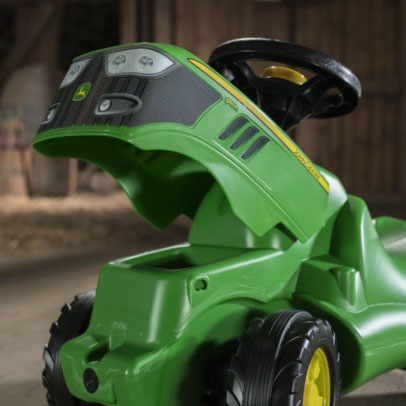 Lifestyle image of the John Deere Mini Trac with the hood lifted.