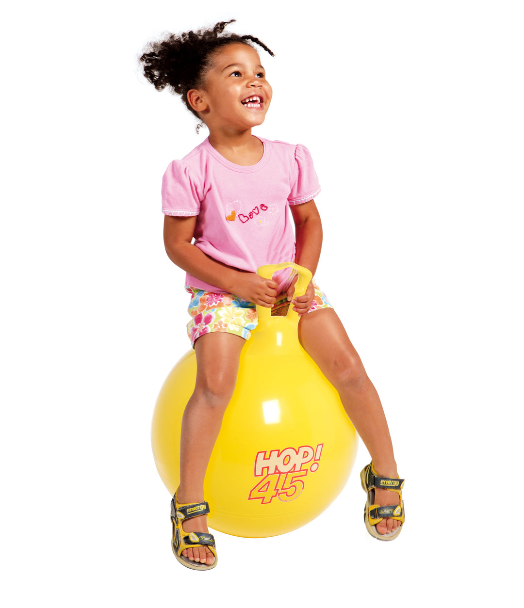 Little girl hopping on the yellow Hop 45 ball
