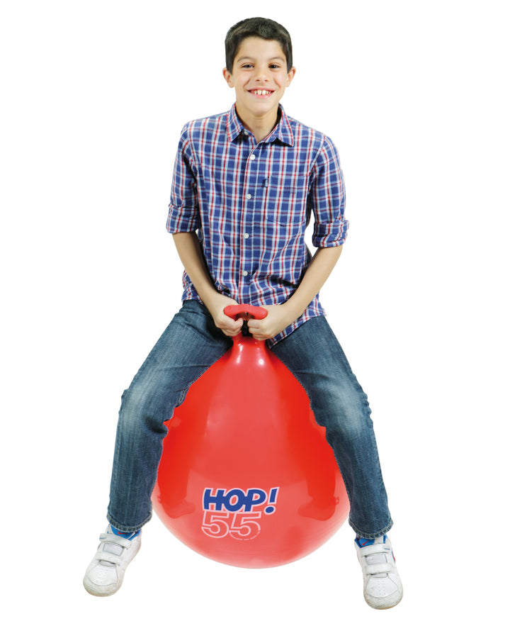 Boy hopping on the red Hop 55 ball