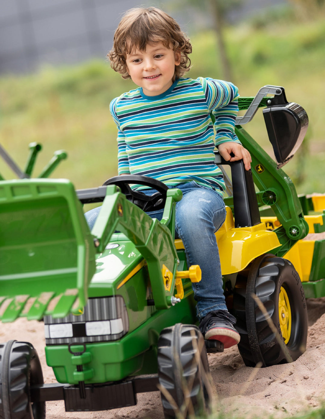 John Deere Backhoe Loader Tractor is a tough pedal tractor with a smooth finish. It comes complete with front loader and backhoe that can be raised and lowered, scooped and tipped using the levers. The oversized resin tires have long lasting rubber tread strip.