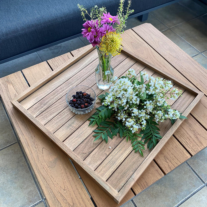 Complete your outdoor patio space with the solid teak Balance Serving Tray. A functional addition offering a modern design for easy entertaining.