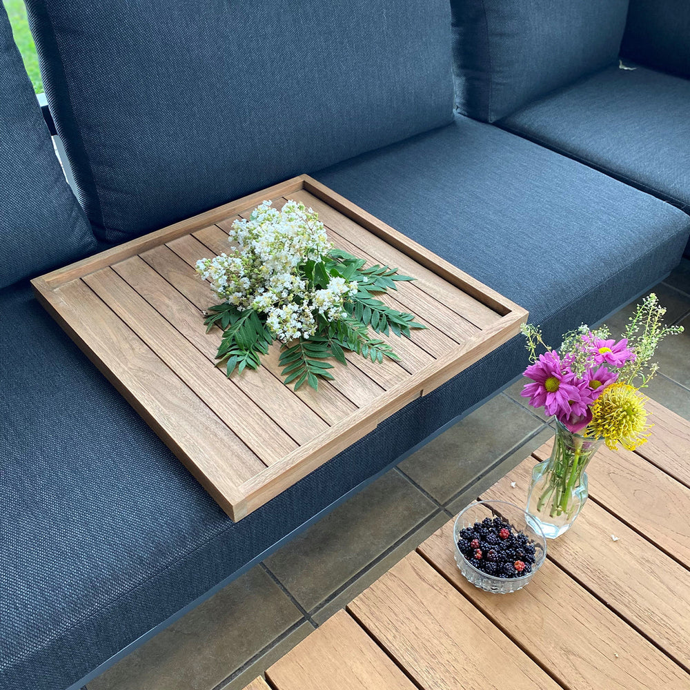 Complete your outdoor patio space with the solid teak Balance Serving Tray. A functional addition offering a modern design for easy entertaining.
