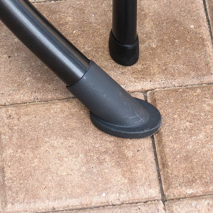Closeup of the adjustable foot on the KETTLER wrought iron table