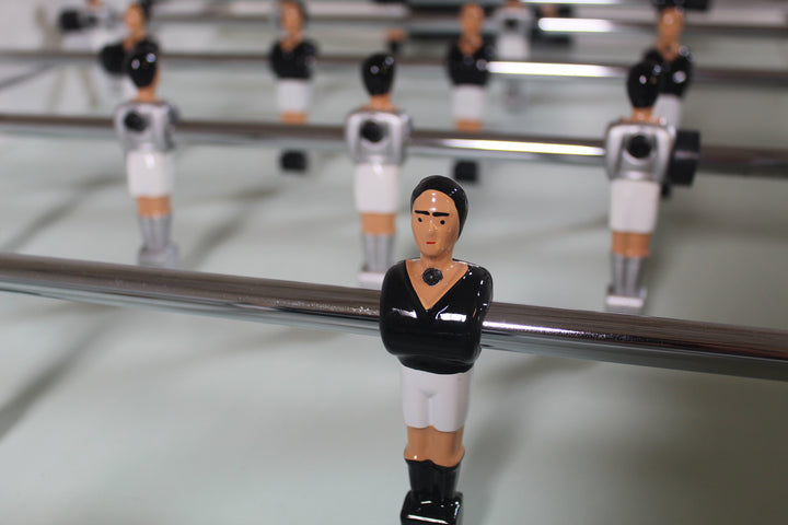Close up of hand painted foosball player, screwed to rod