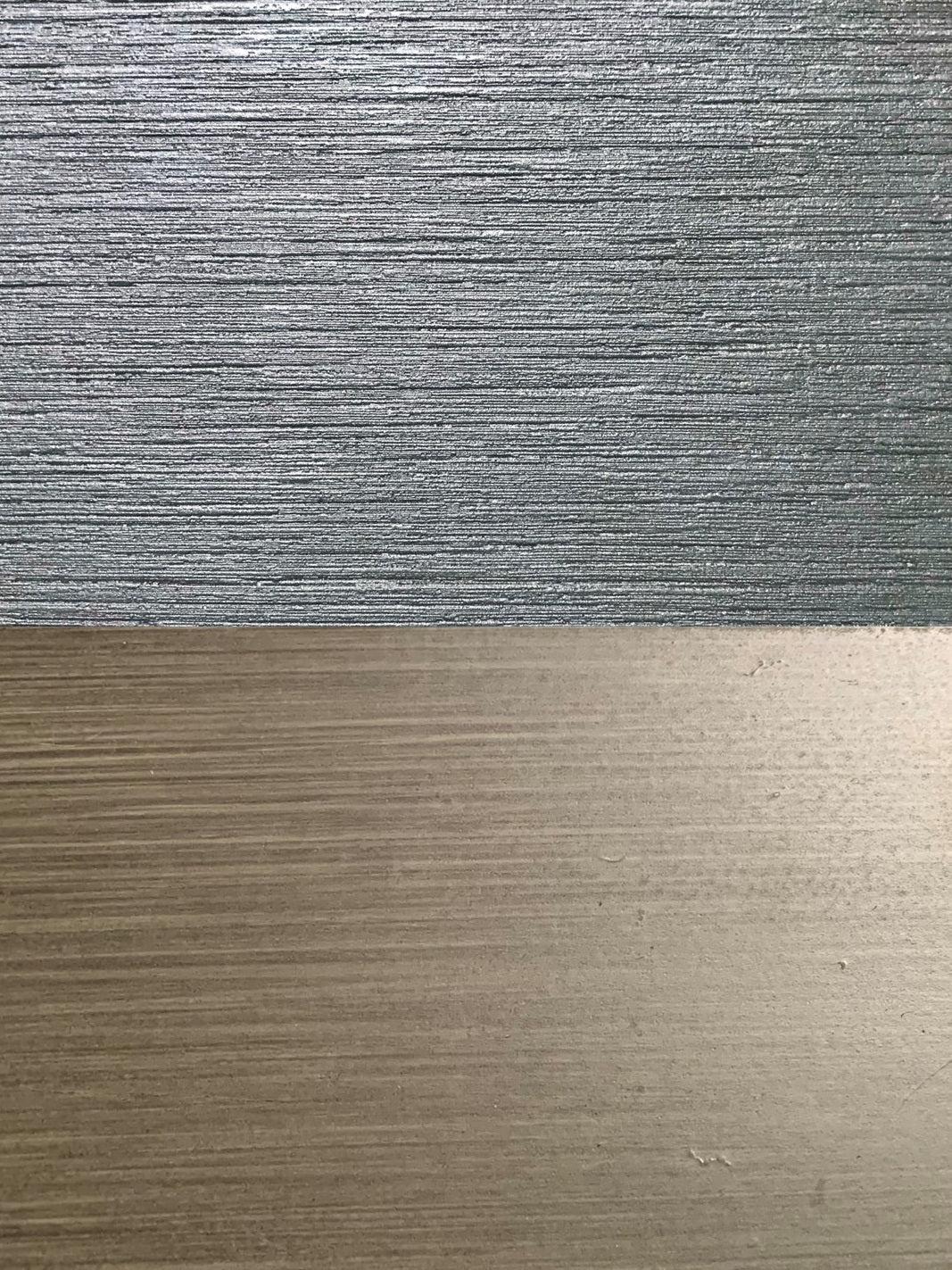 Poly (top) and brushed metal (bottom) top comparison