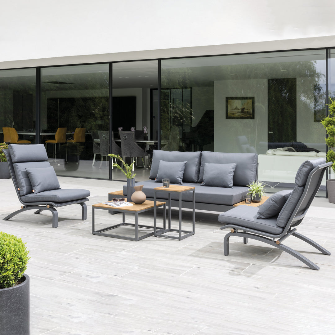 The fresh, laid-back style of the Soho Lounge Set is sure to transform your outdoor living space into a peaceful sanctuary. Share an evening of gathering and fun while relaxing in the open-ended loveseat with built in FSC certified teak end tables and ultra-comfortable all-weather cushions.
