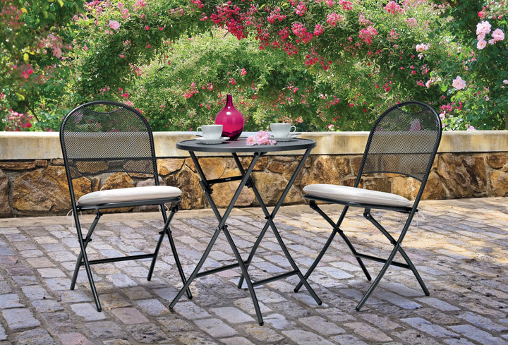 Lifestyle image of fedexable three piece wrought iron set on back porch 